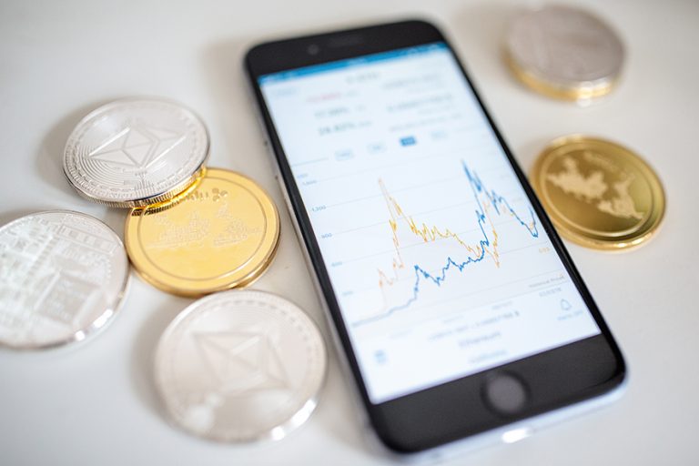 LONDON, ENGLAND - APRIL 25: In this photo illustration of the litecoin, ripple and ethereum cryptocurrency 'altcoins' sit arranged for a photograph beside a smartphone displaying the current price chart for ethereum on April 25, 2018 in London, England. Cryptocurrency markets began to recover this month following a massive crash during the first quarter of 2018, seeing more than $550 billion wiped from the total market capitalisation. (Photo by Jack Taylor/Getty Images)