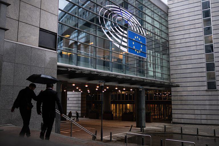 BRUSSELS, BELGIUM - APRIL 09: Commuters shelter from the rain under umbrellas as they walk past the European Parliament on April 09, 2019 in Brussels, Belgium. British Prime Minister Theresa May will return to Brussels on April 10 for the "Special Meeting of the European Council (Article 50)" summit, where members will vote on an extension for the withdrawal of Britain from the EU. (Photo by Leon Neal/Getty Images)