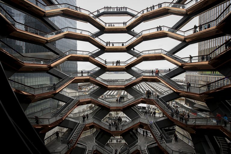 NEW YORK, NY - MARCH 15: Visitors walk through 'The Vessel,' a public art structure consisting of 155 flights o stairs, on the opening day for phase one of the Hudson Yards development on the West Side of Midtown Manhattan on March 15, 2019 in New York City. Four towers, including residential, commercial, and retail space, and a large public art sculpture made up of 155 flights of stairs, called 'The Vessel,' will open to the public. The developer of the project, Related Companies, calls it the most expensive endeavor in the city since Rockefeller Center. (Photo by Drew Angerer/Getty Images)