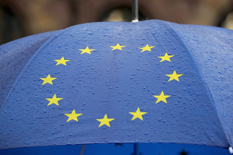 STRASBOURG, FRANCE - MAY 12: An umbrella adorned with the EU flag is carried by a protester during a march against employment laws in the centre of Strasbourg on May 12, 2016 in Strasbourg, France. The United Kingdom will hold a referendum on June 23, 2016 to decide whether or not to remain a member of the European Union (EU), an economic and political partnership involving 28 European countries, which allows members to trade together in a single market and provide free movement across it's borders for cirtizens. (Photo by Christopher Furlong/Getty Images)