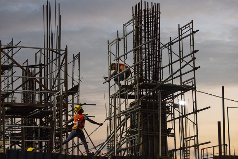 COLOMBO, SRI LANKA - NOVEMBER 20: Chinese Construction workers head home after work on site at a new shopping mall called The Mall at One Galle Face which is part of the Chinese managed Shangri-La retails and office complex on November 20, 2018 in Colombo, Sri Lanka. In just a few years Port City will be the site of tall glass skyscrapers, a busy financial district, hospitals, hotels and even a theme park. As the political crisis escalates in Sri Lanka, former President Mahinda Rajapaksa"u2019s return to power in late October has been watched with increasing concern by countries including the U.S., China and India. The re-entry of Rajapaksa could and raise the influence from Beijing and alter the power dynamics around the Indian Ocean. During Rajapaksa"u2019s 2005-2015 presidency, Sri Lanka saw an influx of Chinese investment and economic support since he relied heavily on China for economic support, military equipment and political cover. While ousted Prime Minister Ranil Wickremesinghe sought to balance relations with New Delhi and Beijing, Rajapaksa made clear his willingness to accept Chinese money even in the face of unreasonable terms while reports from the Central Bank estimated the debt owed to China could be as much as $5 billion and growing every year. Chinese investments paid for a new port, a new airport and new railway on Sri Lanka"u2019s southern coast, among other projects in Colombo, which forced the government to sell strategic assets to Beijing, such as the Hambantota port, when it wasn't able to meet liabilities. For China, the relation with Sri Lanka ties back thousands of years when it was a stop along the old Silk Road trade routes, as it is now known to be a critical link for its Belt and Road Initiative, which aims to expand trade across 65 countries from the South Pacific through Asia to Africa and Europe. (Photo by Paula Bronstein/Getty Images)