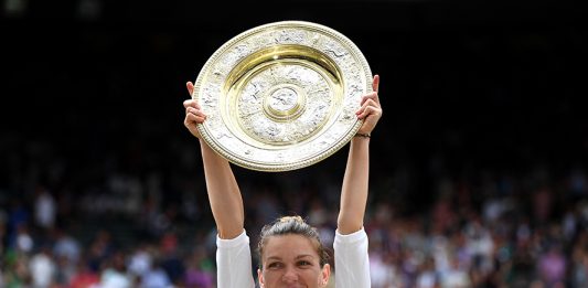LONDON, ENGLAND - JULY 13: Simona Halep of Romania lifts the trophy after winning the Ladies' Singles final against Serena Williams of The United States during Day twelve of The Championships - Wimbledon 2019 at All England Lawn Tennis and Croquet Club on July 13, 2019 in London, England. (Photo by Shaun Botterill/Getty Images)