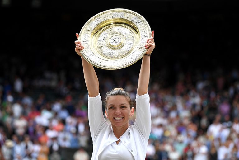 LONDON, ENGLAND - JULY 13: Simona Halep of Romania lifts the trophy after winning the Ladies' Singles final against Serena Williams of The United States during Day twelve of The Championships - Wimbledon 2019 at All England Lawn Tennis and Croquet Club on July 13, 2019 in London, England. (Photo by Shaun Botterill/Getty Images)