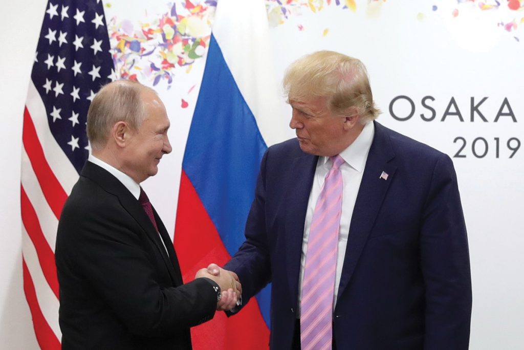 epa07679049 Russian President Vladimir Putin (L) shakes hands with US President Donald J. Trump (R) during their meeting on the sidelines of the G20 leaders summit in Osaka, Japan, 28 June 2019. The summit gathers leaders from 19 countries and the European Union to discuss topics such as global economy, trade and investment, innovation and employment. EPA/MICHAEL KLIMENTYEV/SPUTNIK/KREMLIN POOL