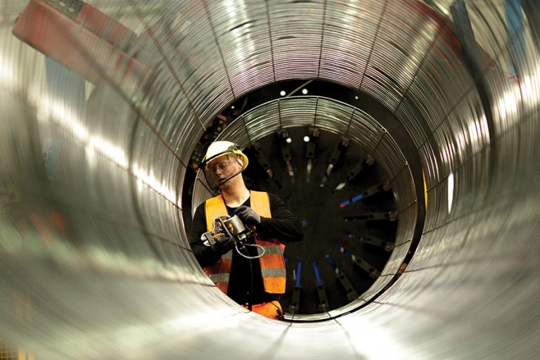 SASSNITZ, GERMANY - OCTOBER 19: An employee works on an iron cage the production process of pipes in the production hall at the Nord Stream 2 facility at Mukran on Ruegen Islandon October 19, 2017 in Sassnitz, Germany. Nord Stream is laying a second pair of offshore pipelines in the Baltic Sea between Vyborg in Russia and Greifswald in Germany for the transportation of Russian natural gas to western Europe. An initial pair of pipelines was inaugurated in 2012 and the second pair is due for completion by 2019. A total of 50,000 pipes are currently on hand at Mukran, where they receive a concrete wrapping before being transported out to sea. Russian energy supplier Gazprom, whose board is led by former German chancellor Gerhard Schroeder, owns a 51% stake in Nord Stream. (Photo by Carsten Koall/Getty Images)