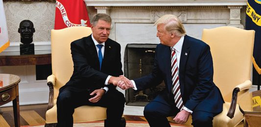 epa07782917 U.S. President Donald Trump (R) shakes hands with Klaus Iohannis, Romania's president, in the Oval Office of the White House in Washington, D.C., USA, 20 August 2019. Trump said today he's 'not ready to make a deal with China,' but adds Beijing wants an agreement and something could happen soon. EPA/Andrew Harrer / POOL
